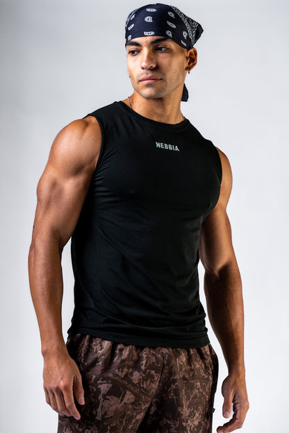 Front view of NEBBIA 899 Seamless Tank in Black & Black on a muscular athlete under studio lighting.