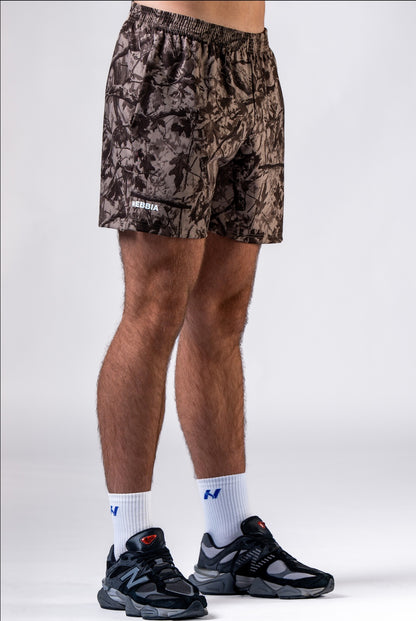 Front view of NEBBIA 902 Power Training Shorts in Black & Light Brown Camo on an athlete.