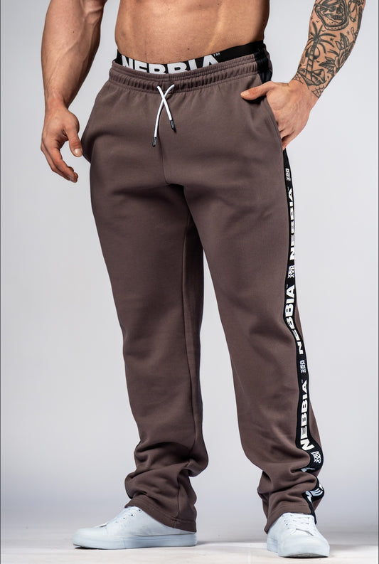 Front view of NEBBIA Hero 296 Training Sweatpants in Black/Brown featuring a tapered athletic fit and branded side-tapes.