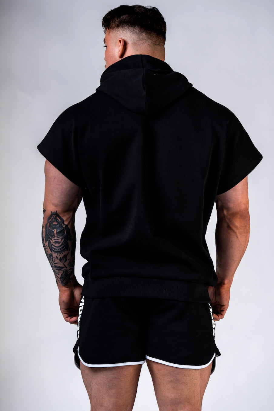 Side profile of men's short sleeve gym hoodie 297 showing the comfortable fit and professional bodybuilding aesthetic.