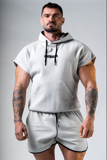 Front view of NEBBIA Hero 297 Training Rag Top in Light Grey/Black featuring a powerful athletic silhouette and chest logo
