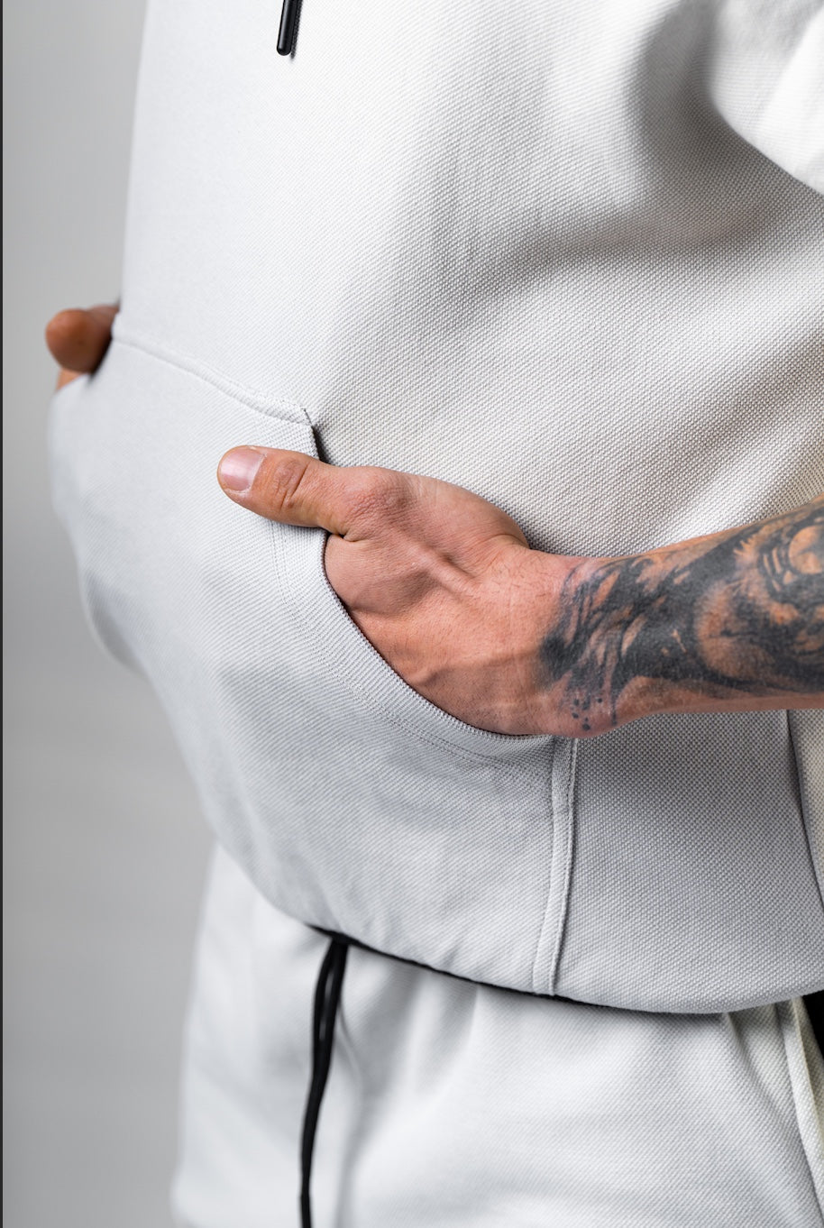 Close-up of the high-quality NEBBIA appliqué logo and fabric texture on the 297 Light Grey Rag Top.