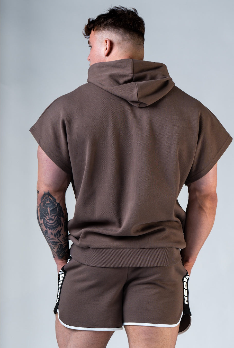 Back view of the 297 Rag Top demonstrating the structured masculine silhouette and hood detail.