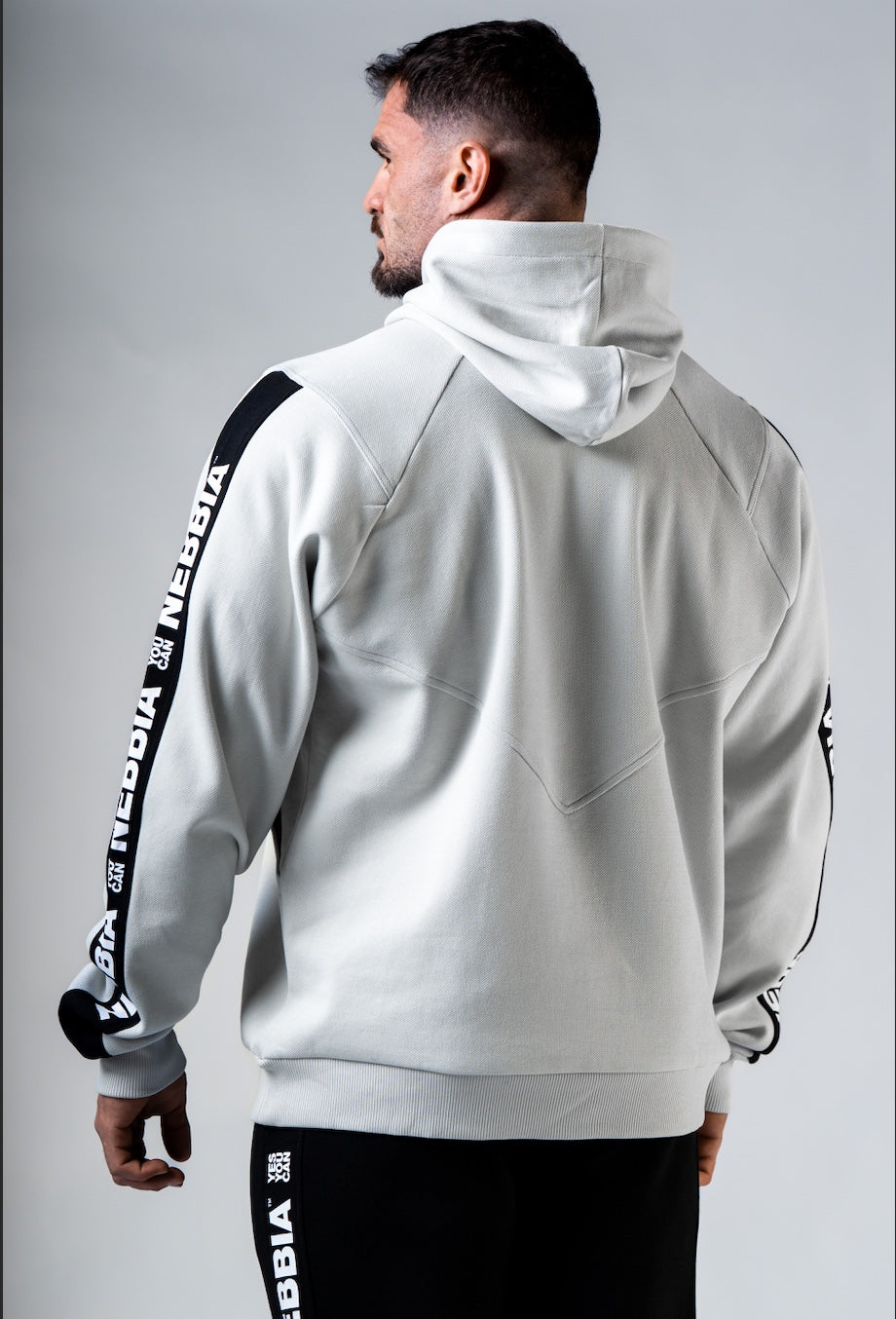 Back view of the NEBBIA 300 hoodie demonstrating the structured masculine cut and hood design.