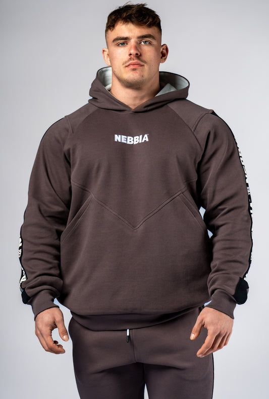 Front view of NEBBIA Hero 300 Training Hoodie in Black/Brown, highlighting the powerful silhouette and chest logo.