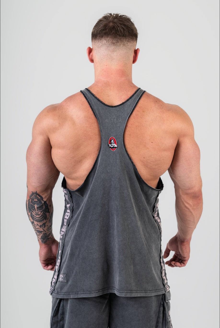 Back view of the 791 Muscle Back Stringer demonstrating the shoulder and lat exposure for bodybuilding training.