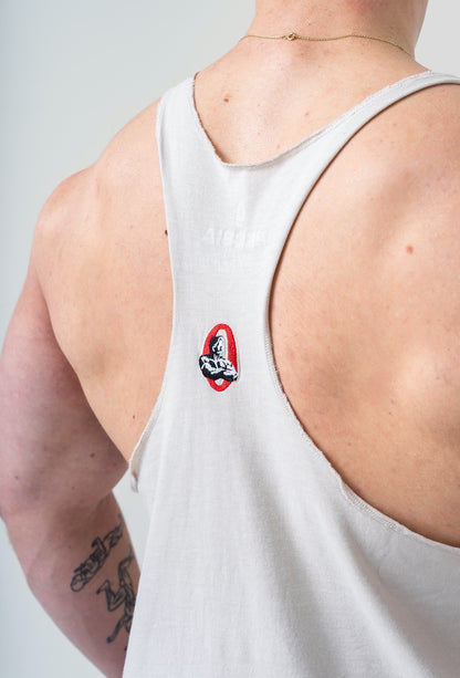 Side profile of the 791 light grey stringer showing the deep-cut armholes and thin straps for lat exposure.