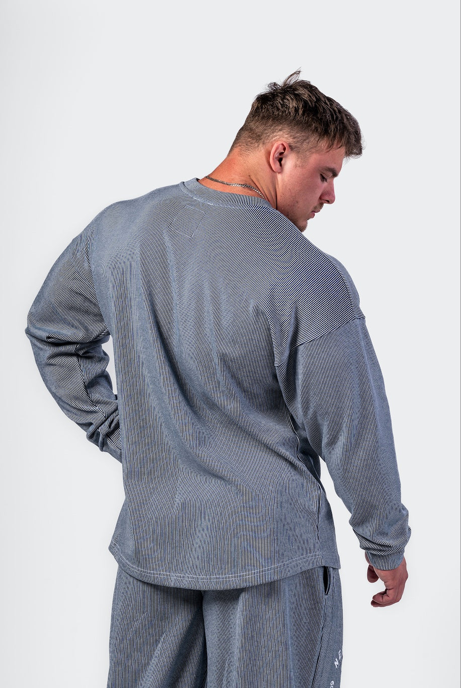 Back view of the NEBBIA 797 sweatshirt highlighting the clean, oversized masculine silhouette.