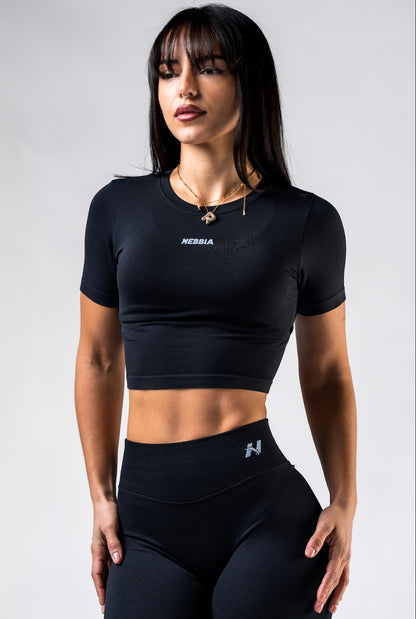 Front view of NEBBIA 891 Seamless Crop Top in Black, showing the high-waisted fit and short sleeves.